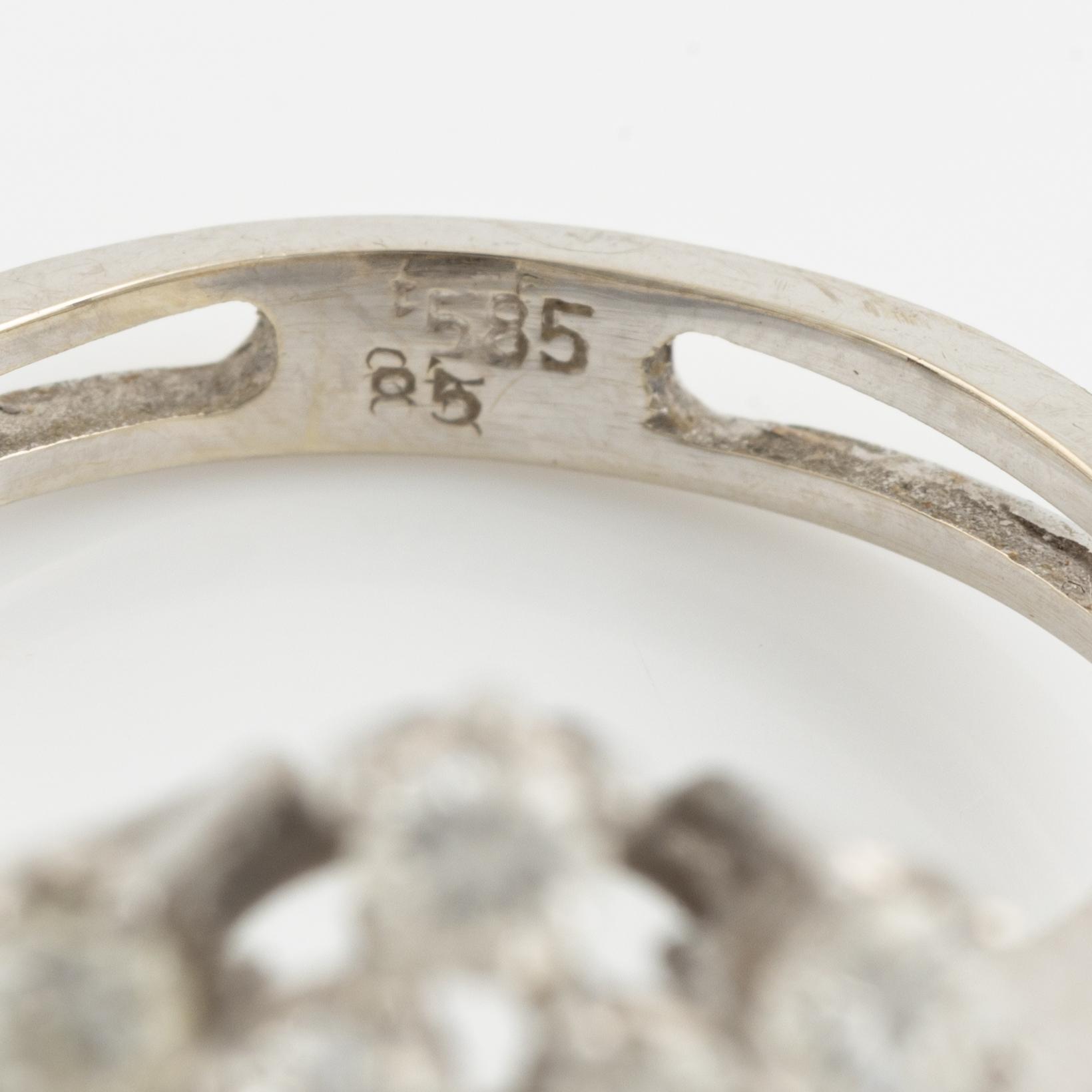 14K white gold and brilliant cut diamond cluster ring.