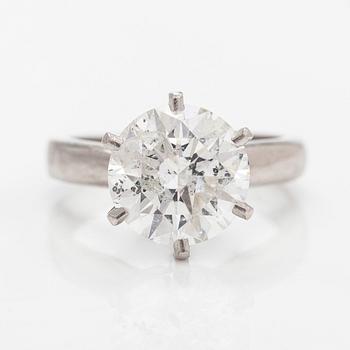 A platinum ring, with a brilliant-cut diamond approximately 3.10 ct. Domino Jewellery, Birmingham, England.