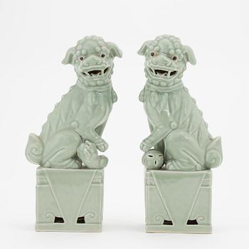 A pair of celadon glazed figures of buddhist lions, China, 20th Century.