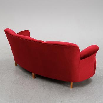 A first half of the 20th Century sofa with velvet upholstery.