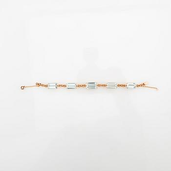 Bracelet 18K gold with step-cut aquamarines.