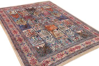 A Kashmar carpet, c. 387 x 297 cm.