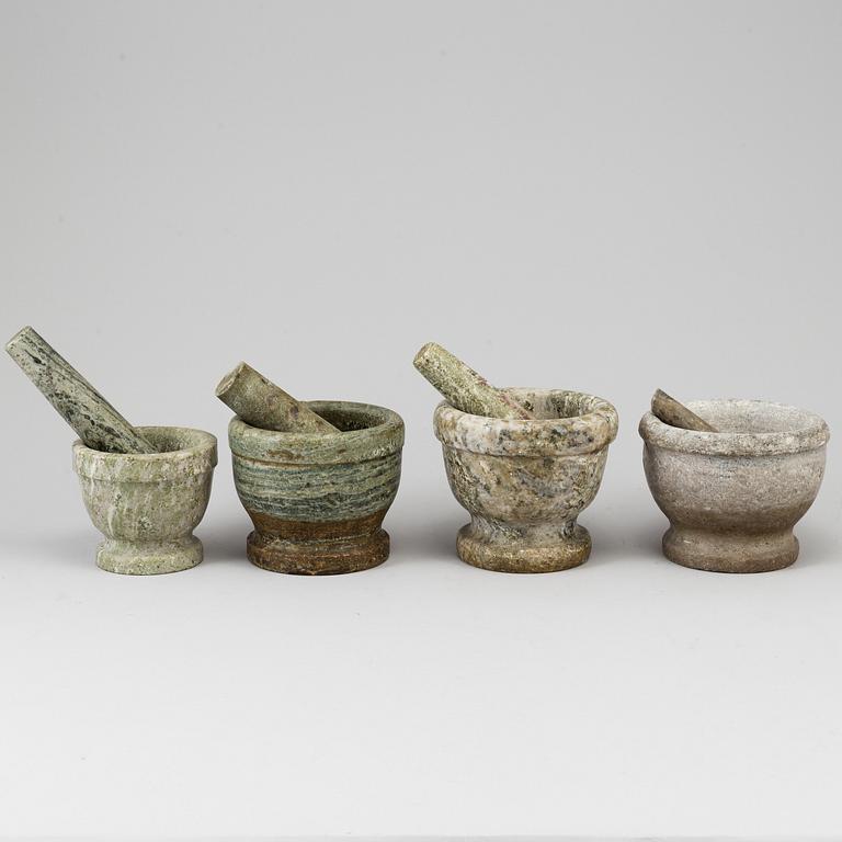 Four Swedish green marble mortars and pestles, early 20th century.