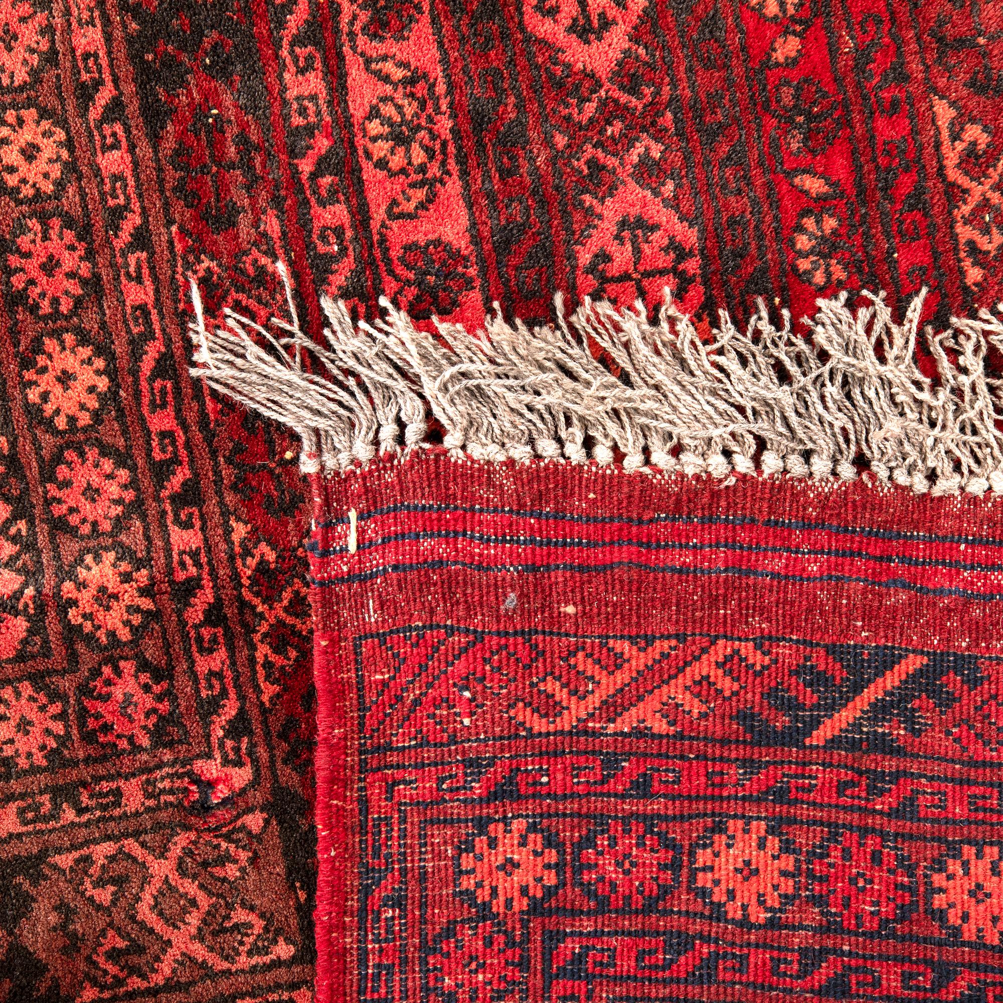 A semaintique Afghan carpet ca 390x300 cm.