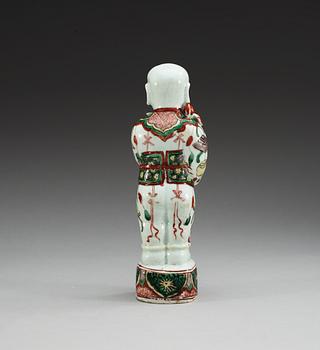 A famille verte figure of a boy, Qing dynasty, Kangxi (1662-1722).