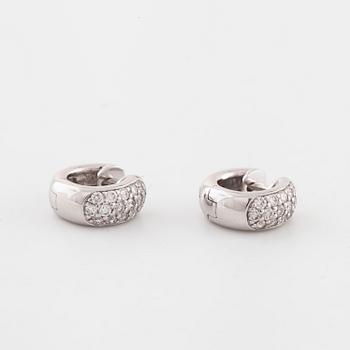 A pair of brilliant cut diamond earrings..