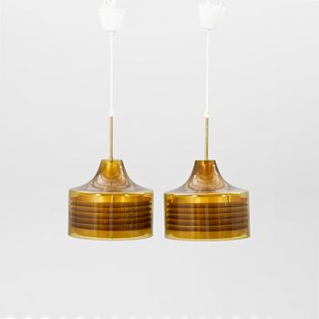 A pair of Fagerhult glass and brass ceiling pendants 1960/70s.