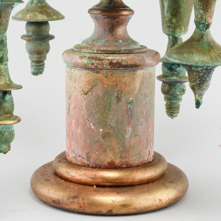 a metal sculpture/candelabra, signed and dated 2006.