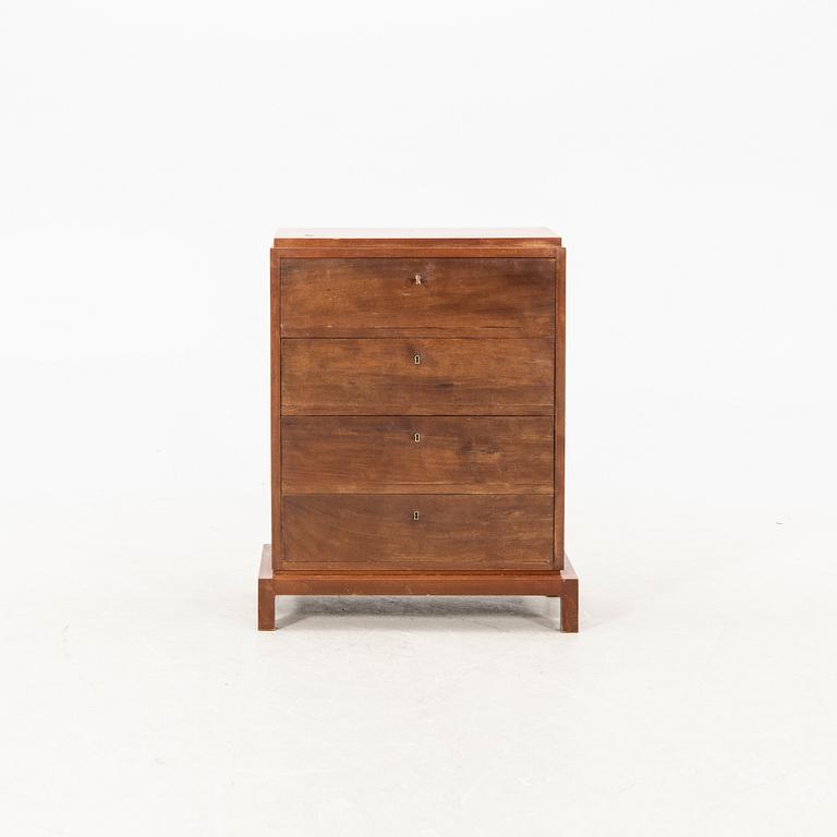 A laquered wooden dresser from the first half of the 20th century.