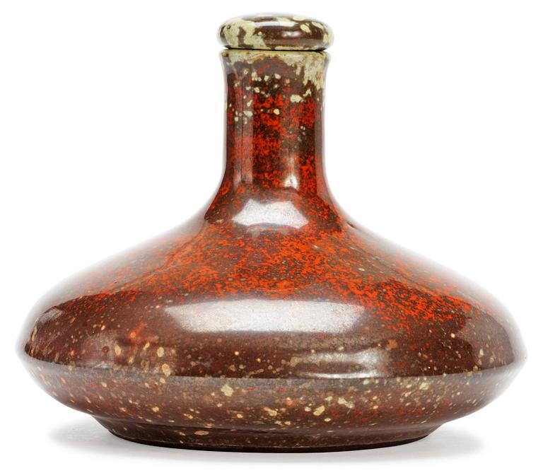 A Hans Hedberg faience bottle with stopper.