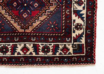 An oriental runner, c. 395 x 100 cm.