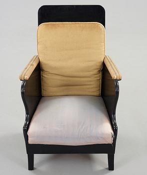 Carl Bergsten, a black lacquered armchair, Nordiska Kompaniet, Sweden ca 1918.