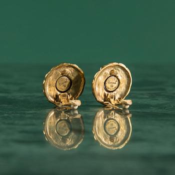 Earclips by Chanel.