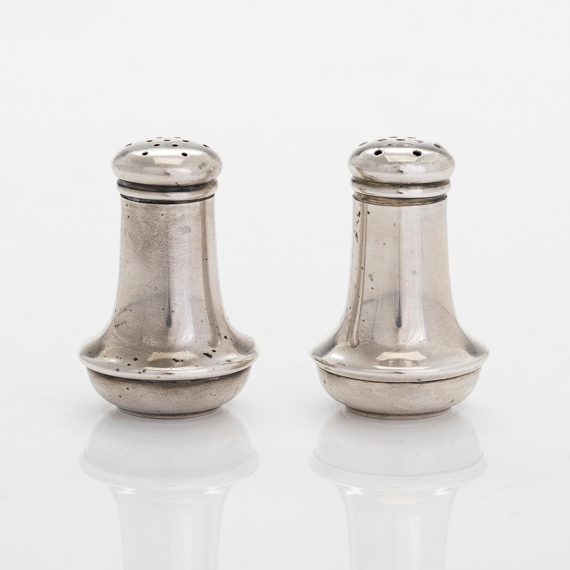 Tiffany & Co MAKERS, a four piece set of sterling silver bowls, salt and pepper shakers by other maker.