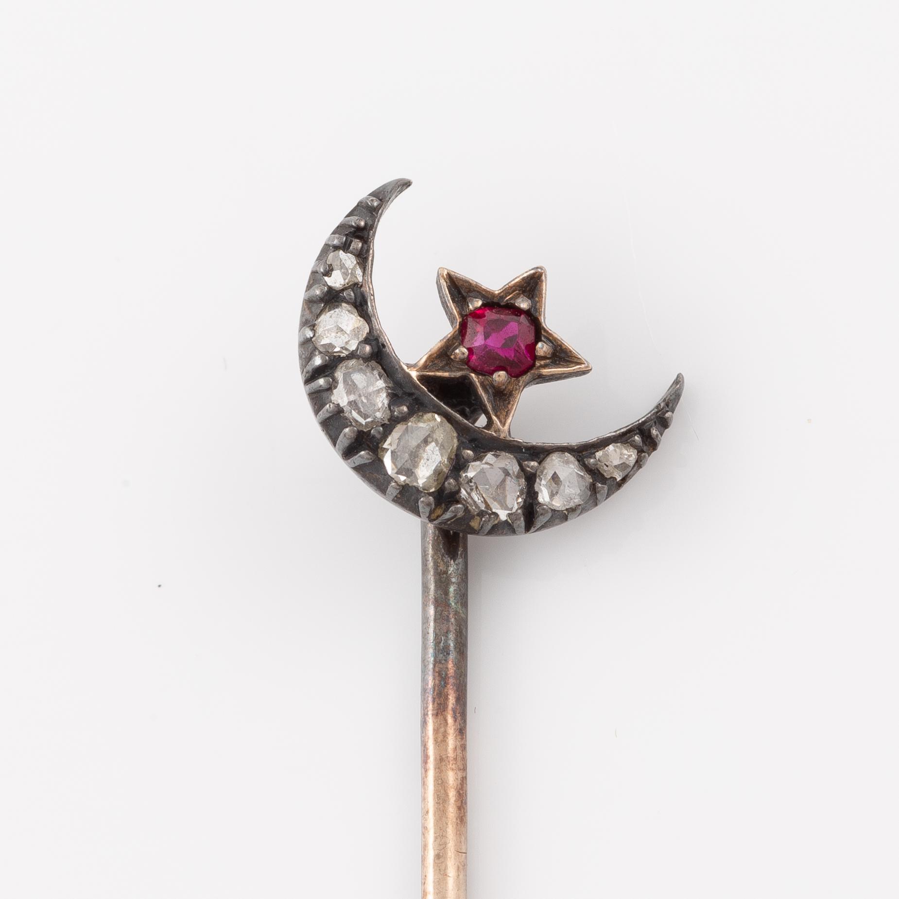 Brooch, set with rose-cut diamonds and a ruby in the shape of a crescent moon with a star.