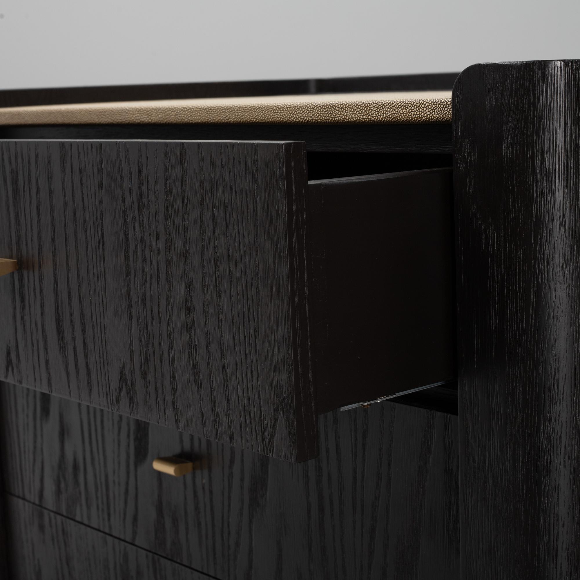 A black stained oak veneered 'Milano' dresser with top covering of faux stingray skin.