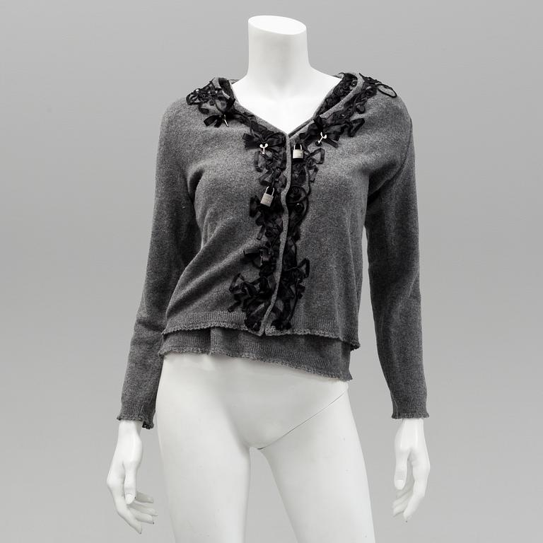 Cardigan and top by Moschino, Cheap and Chic.