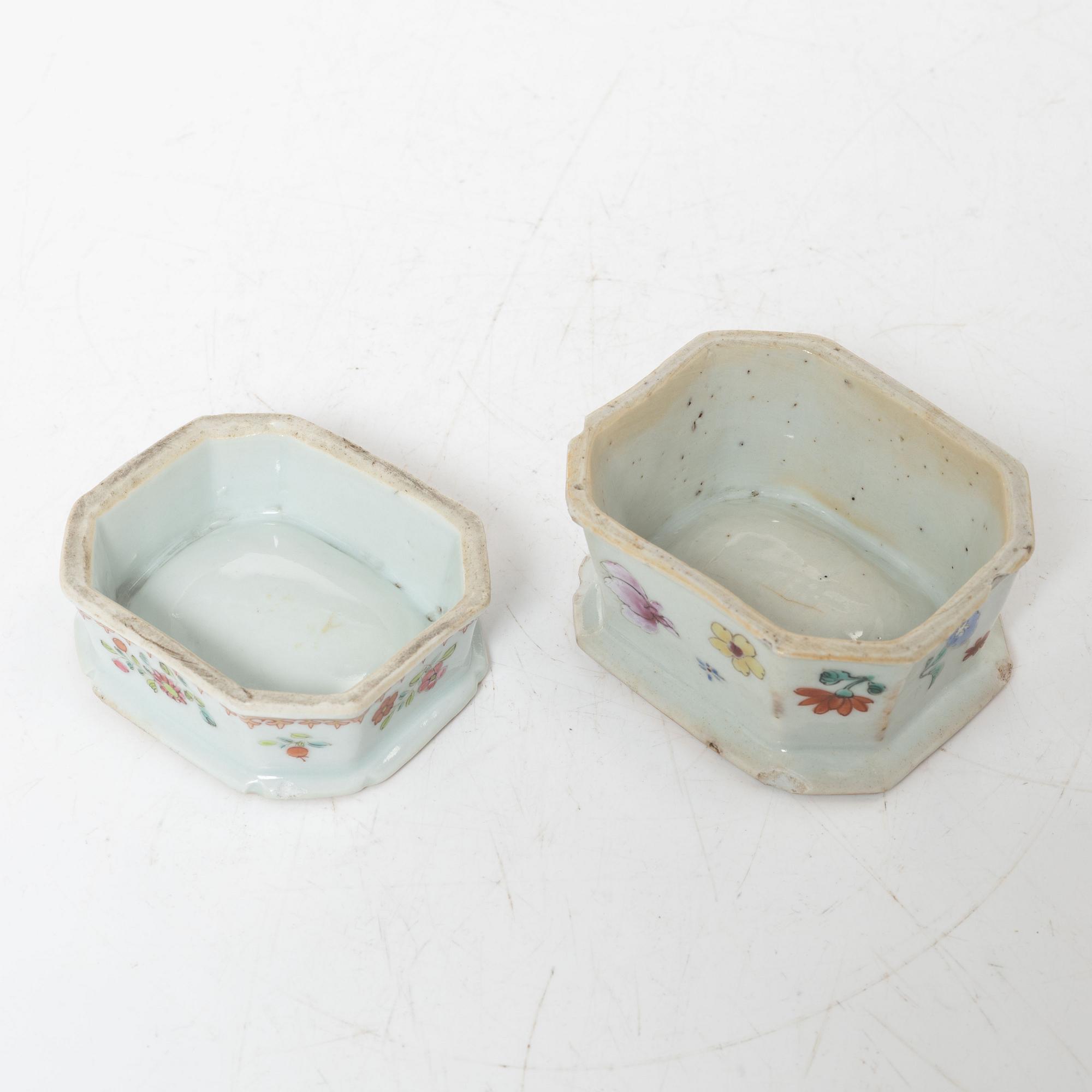 A small Chinese famille rose porcelain tureen with cover and stand, two salt cellars, Qing dynasty, Qianlong (1736-95).