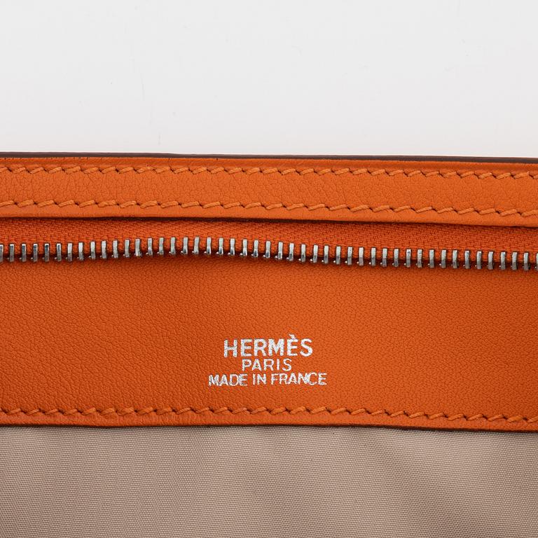 Hermès, A orange Veau Gulliver 'Divers (agendas) Trousse Zipp' pencil case, 2003.
