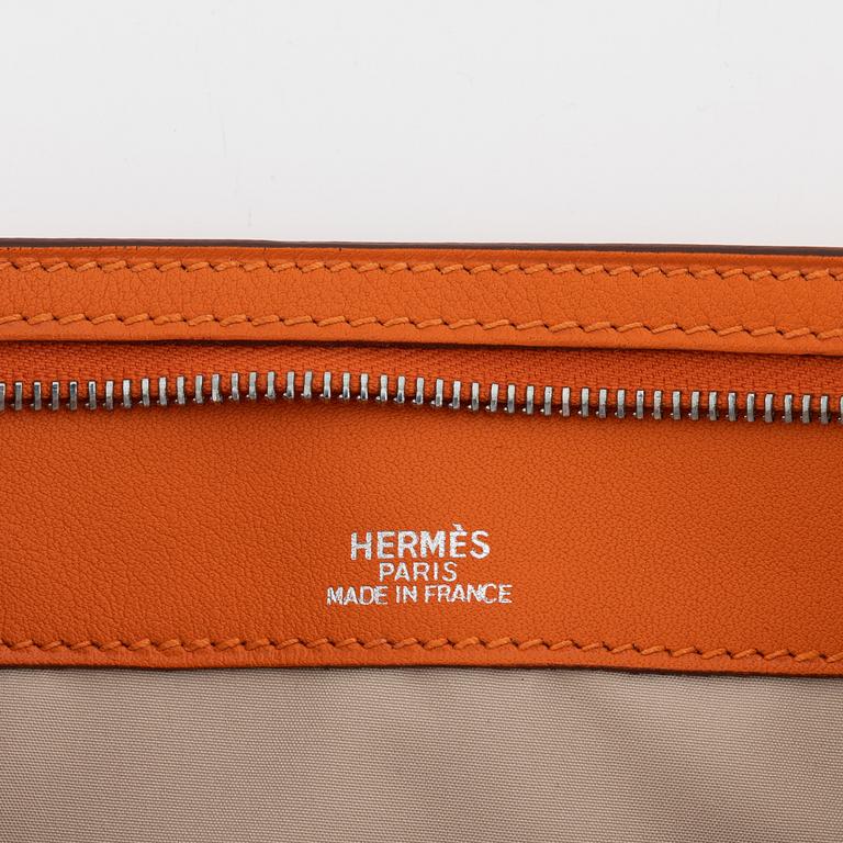 Hermès, A orange Veau Gulliver 'Divers (agendas) Trousse Zipp' pencil case, 2003.