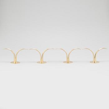 Four brass candle sticks "Liljan" by Ivar Ålenius-Björk for Ystad metall, second half of the 20th century.