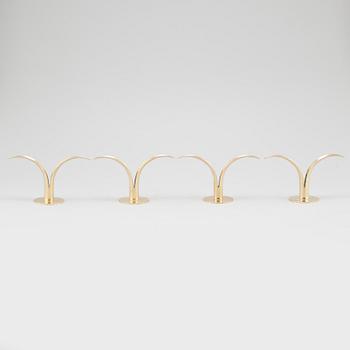 Four brass candle sticks "Liljan" by Ivar Ålenius-Björk for Ystad metall, second half of the 20th century.