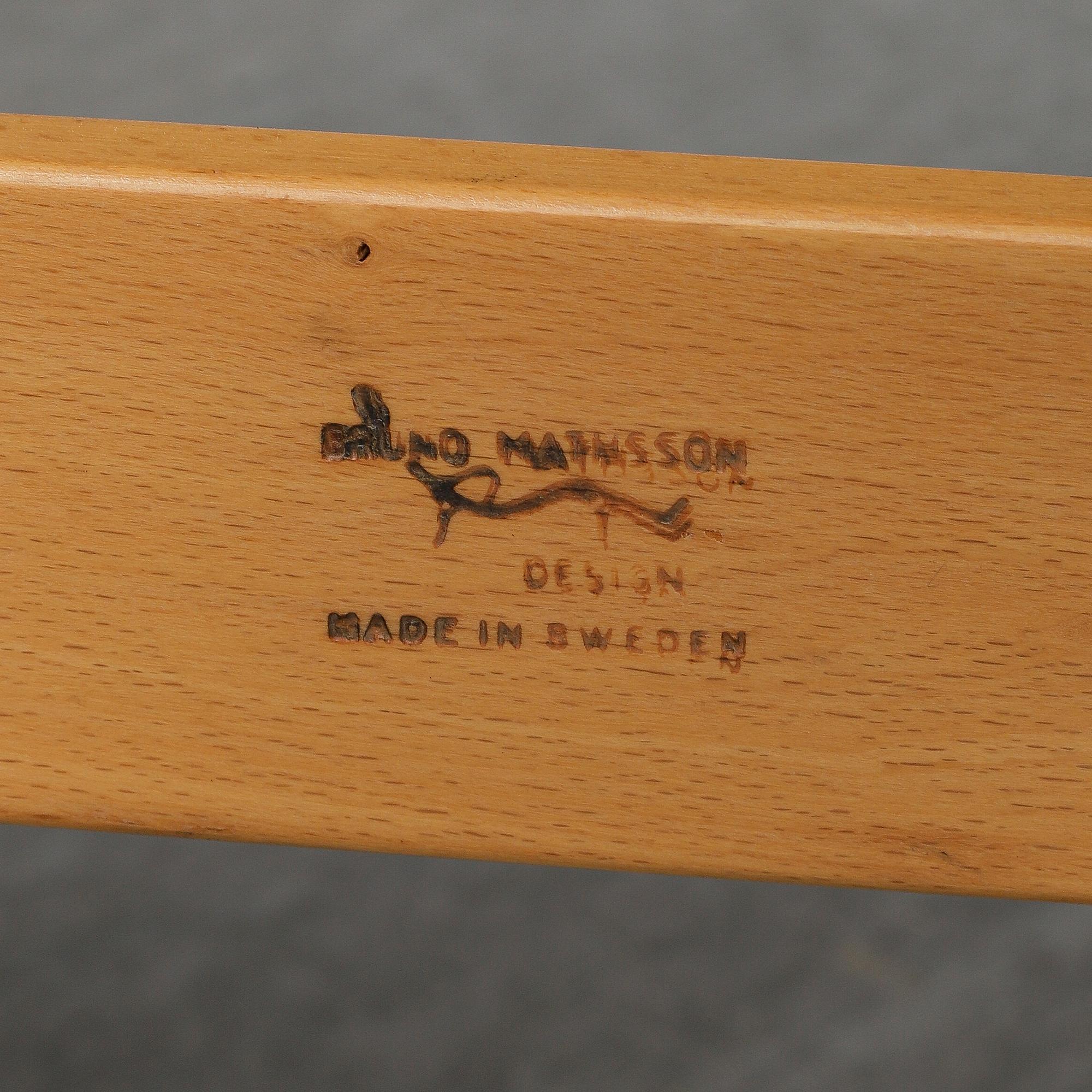 A second half of the 20th Century pair of 'Mina' armchairis by Bruno Mathsson for Mathsson International.
