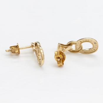 A pair of 14K gold earrings with diamonds ca. 0.01 ct in total.