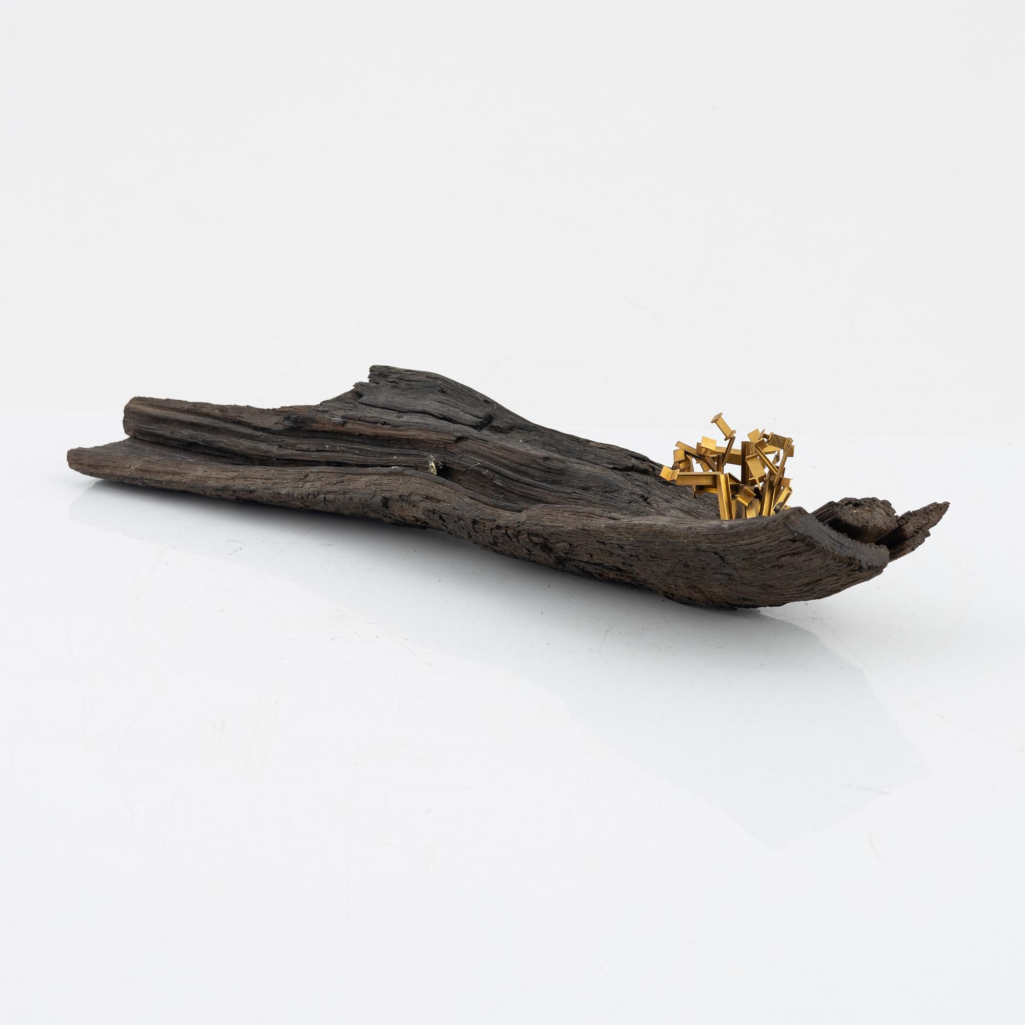 Arne Jones, sculpture, brass on driftwood, signed on label by the estate.
