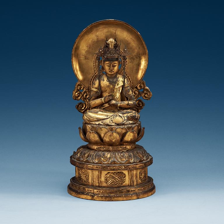 A Japanese gilt wooden seated figure of Buddha, 19th Century.