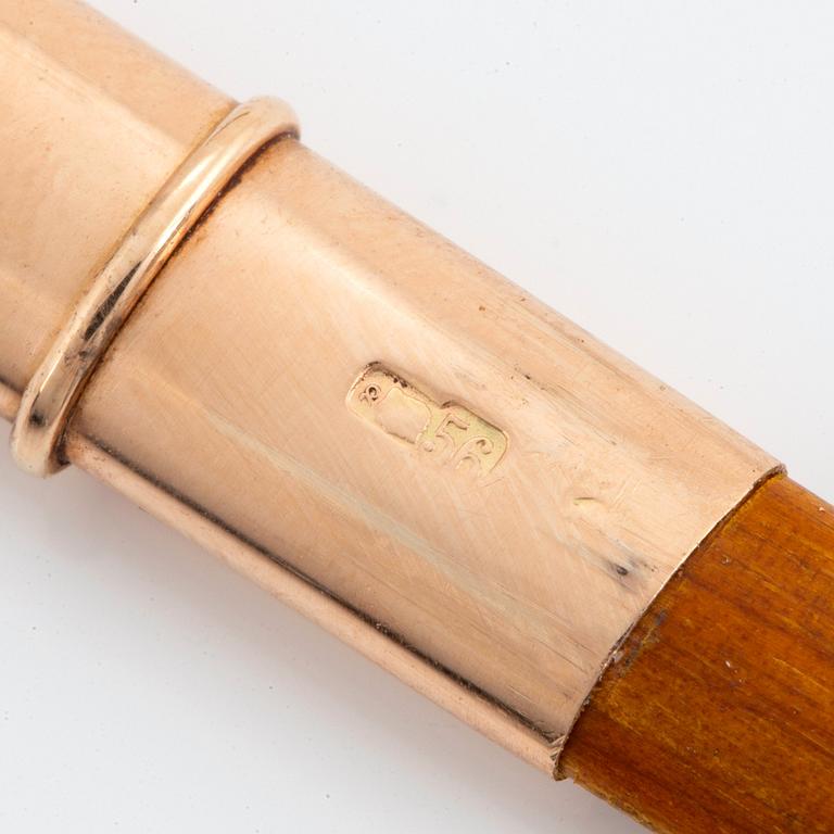 A 14K gold-mounted guilloché enamel pencil holder.