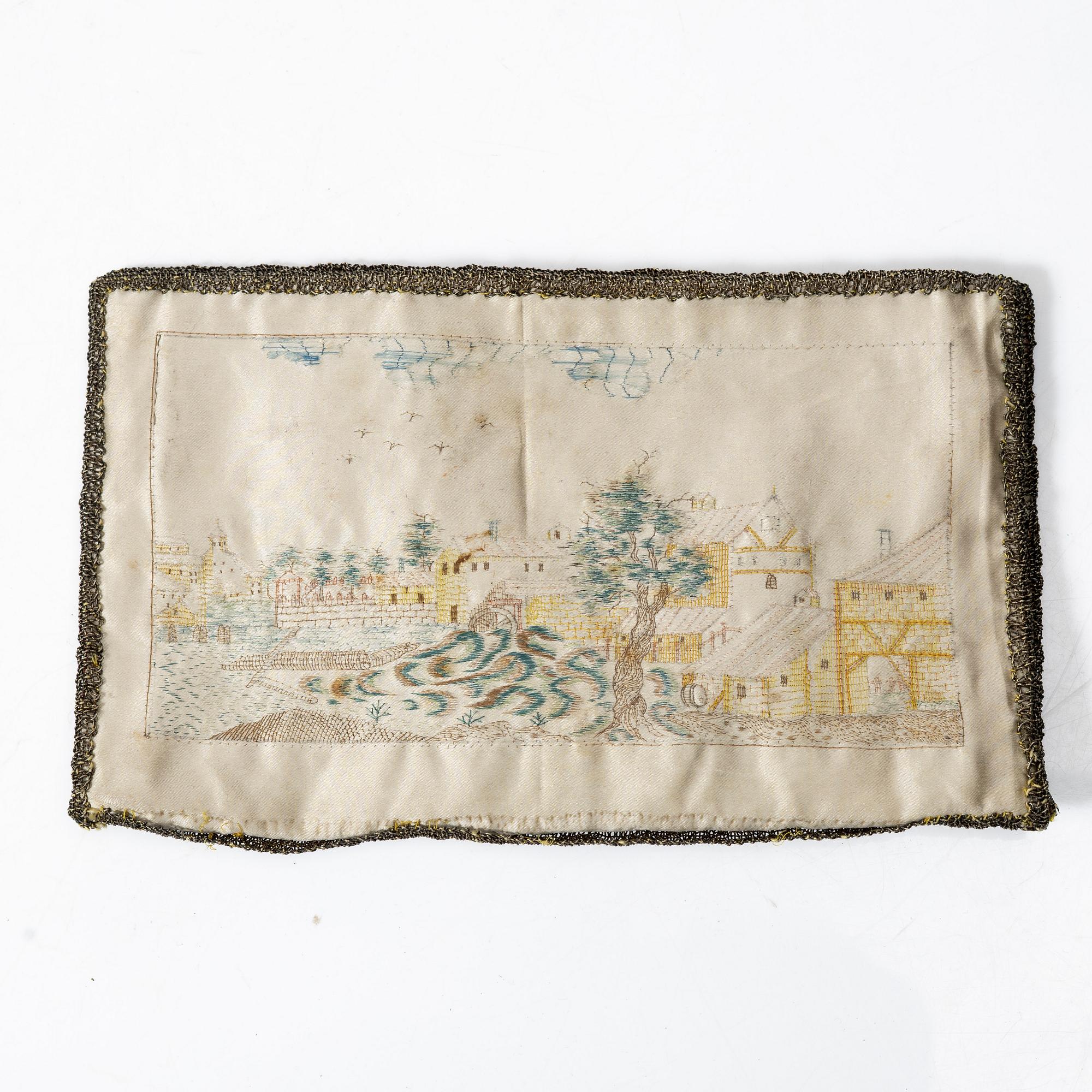 A silk embroidered wallet, dated 1773.