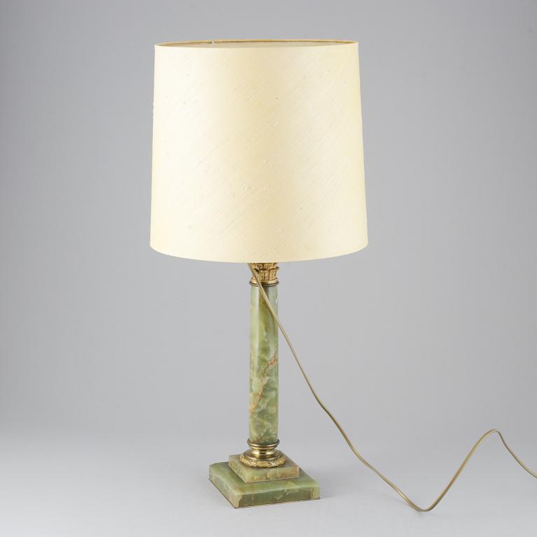 A 20th century empire style table lamp.
