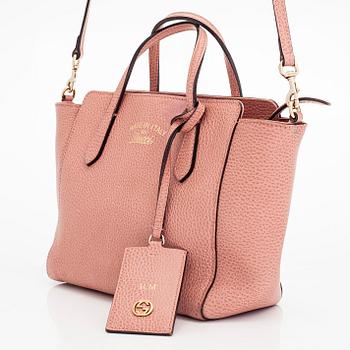 Gucci, 'Mini Swing' bag.