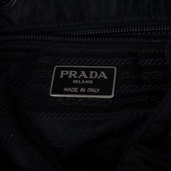 Prada, A nylon and leather backpack.