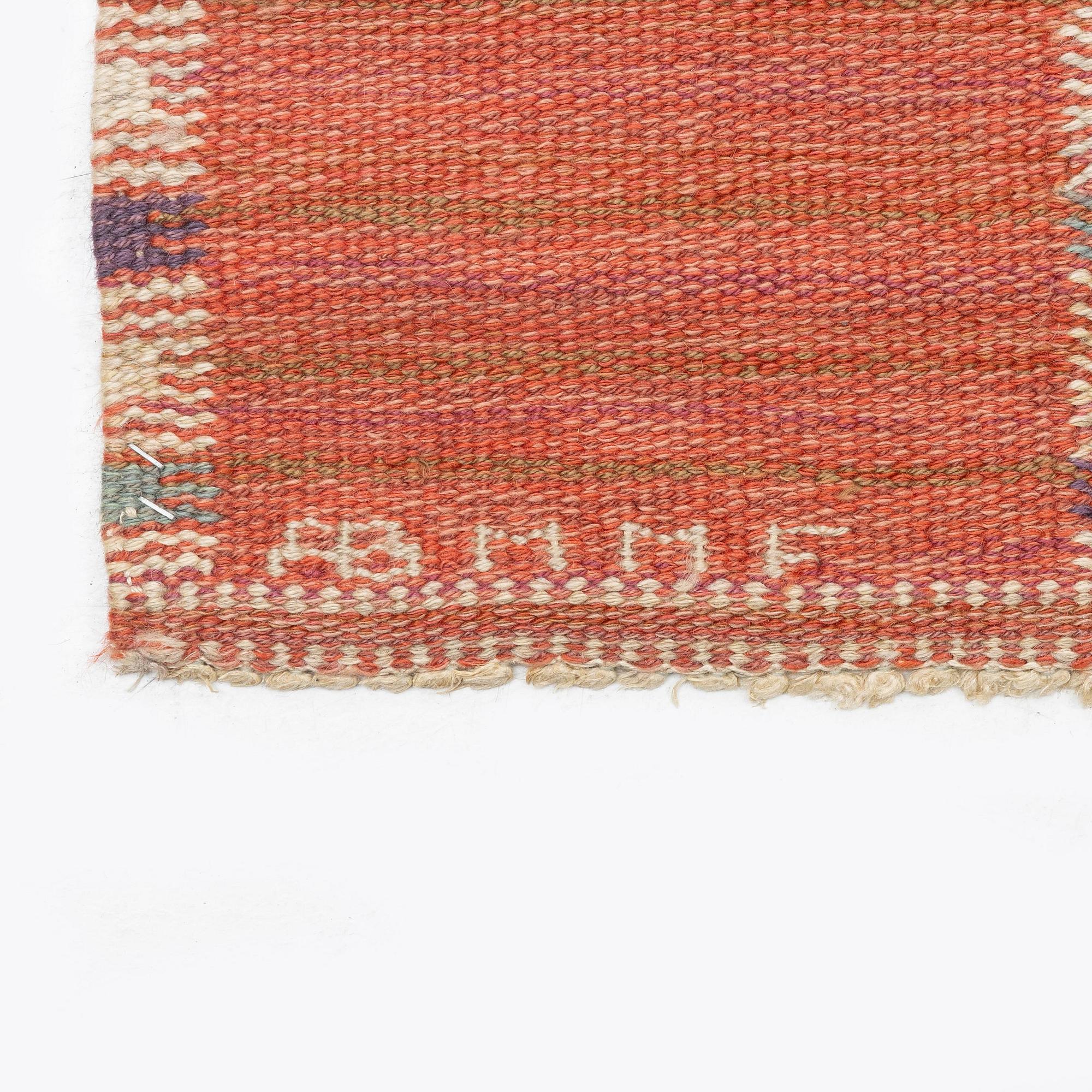 Barbro Nilsson, a carpet, 'Falurutan, röd Borås', flat weave, c. 502 x 212 cm, signed AB MMF BN.