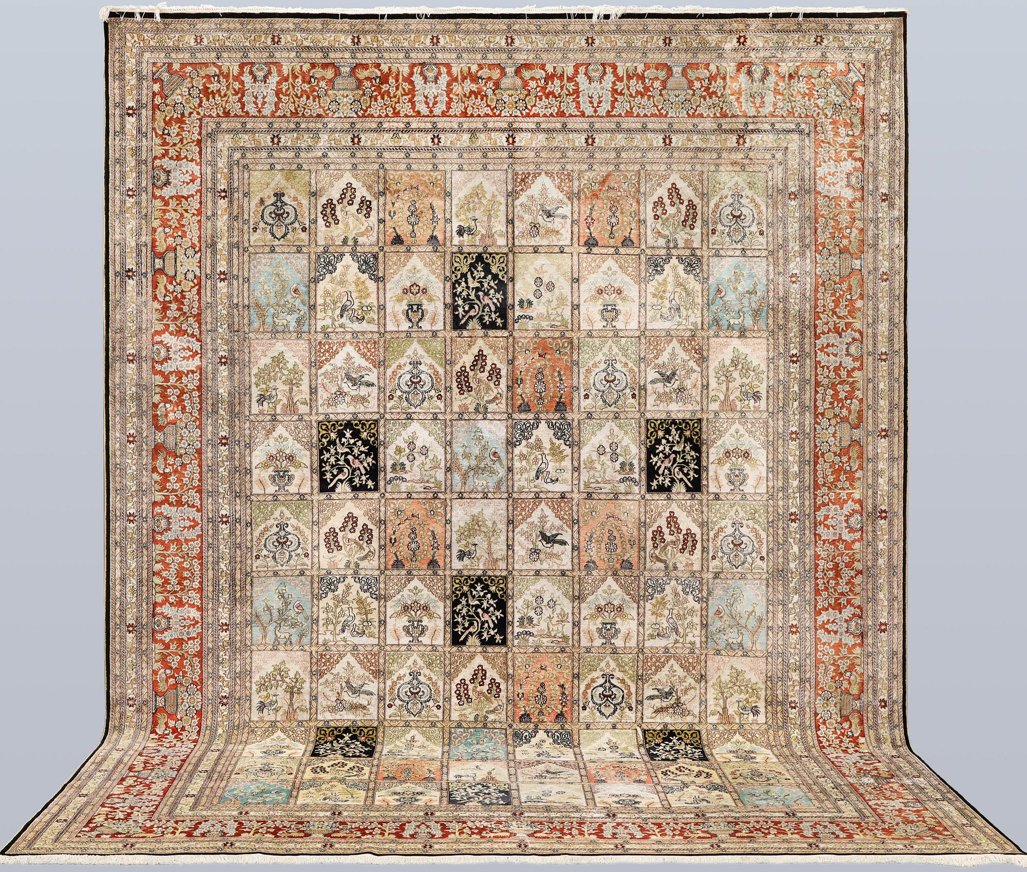 An oriental silk carpet, approx. 376 x 274 cm.