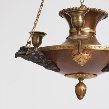 A Swedish patinated bronze and copper three-light chandelier, early 19th century.