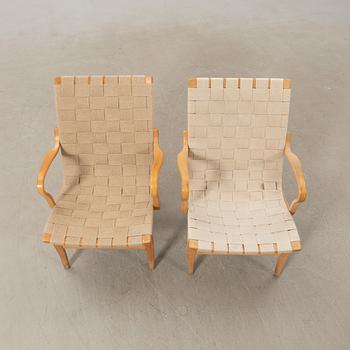 Bruno Mathsson, a pair of "Eva" armchairs, Bruno Mathsson Company, Värnamo, late 20th century.