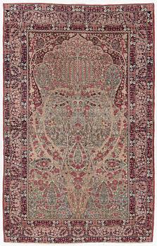 An antique Kirman rug, south Persia, c. 220 x 140 cm.