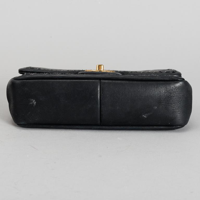 CHANEL, a black quilted fabric 'Flap Bag', 2015-2016.