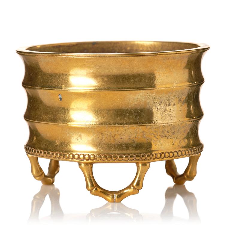 A gilt bronze tripod censer, Qing dynasty, possibly 18th Century.