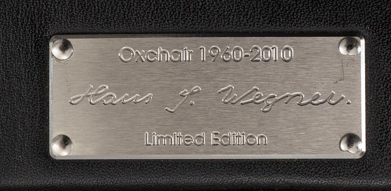 HANS J WEGNER, "Ox chair" lounge chair and stool.