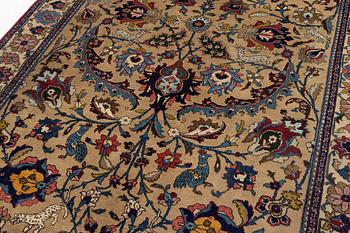 A semi-antique Tabriz of  'Sickle-Leaf' design, c 240 x 161 cm.