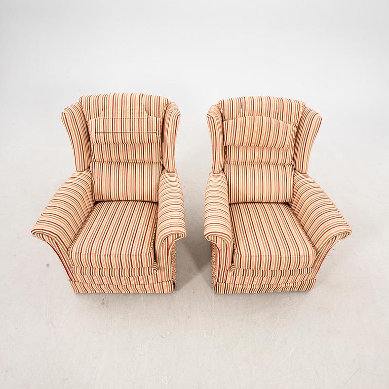 A pair of easy chairs with footstools by Bröderna Andersson 21st century.