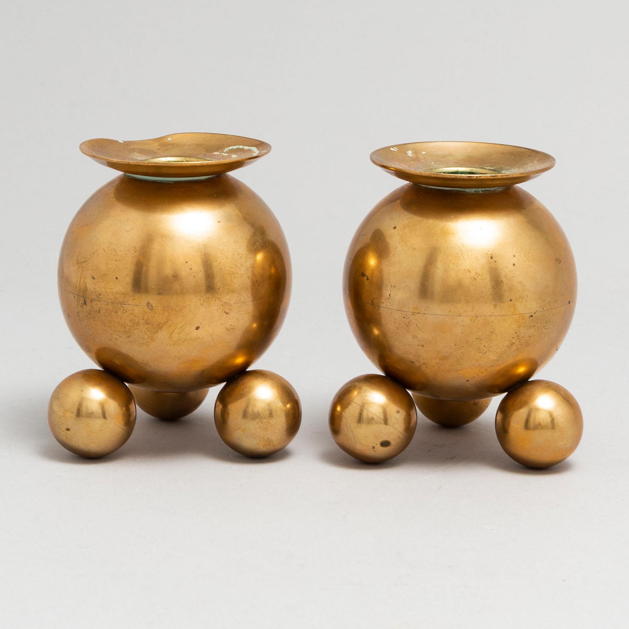 A pair of brass candlesticks from Gusum, circa 1900.
