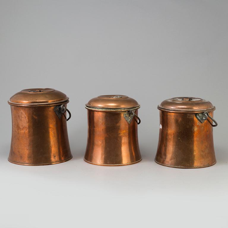 THREE 19TH CENTURY COPPER MILK CHURNS.