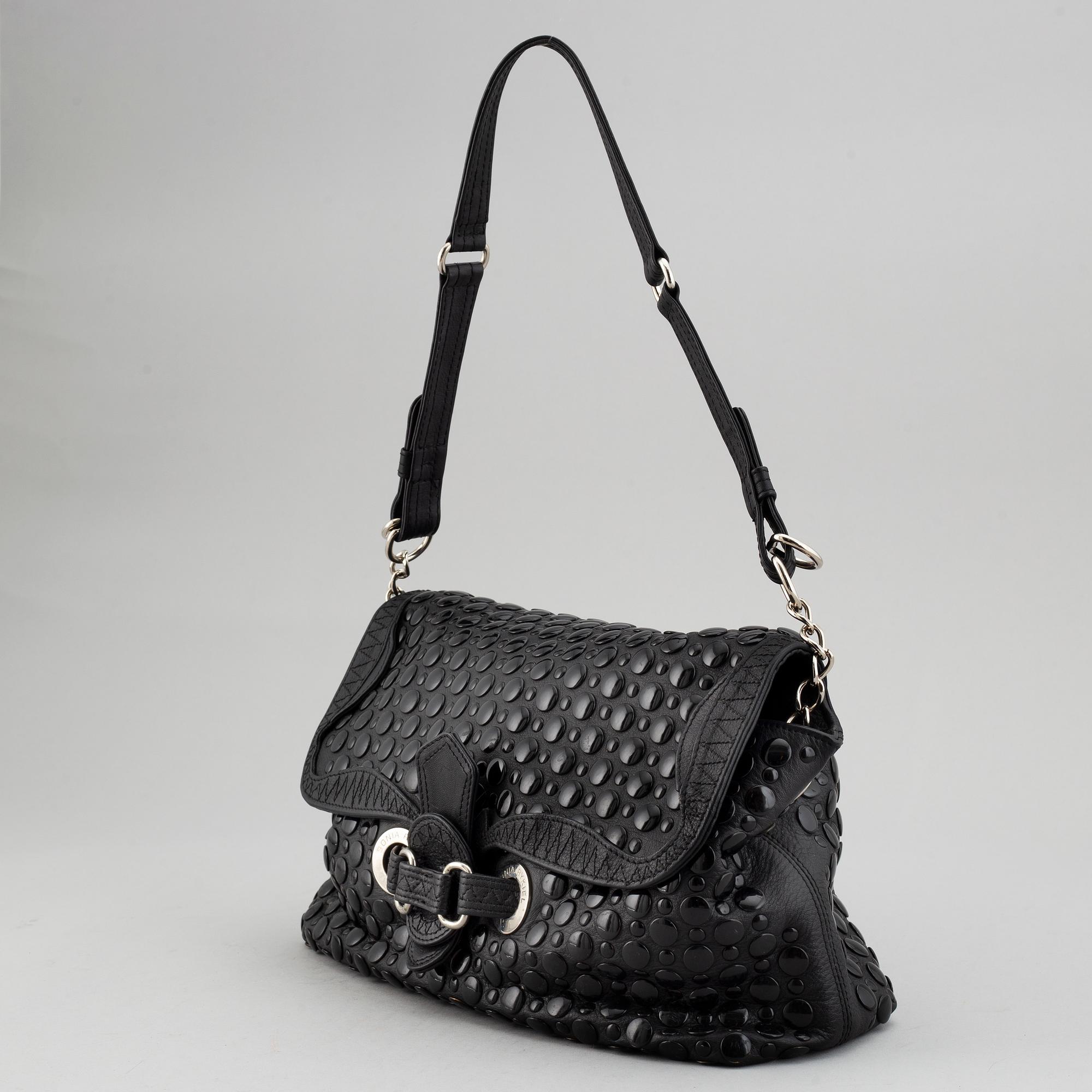 SONIA RYKIEL, a black leather bag.