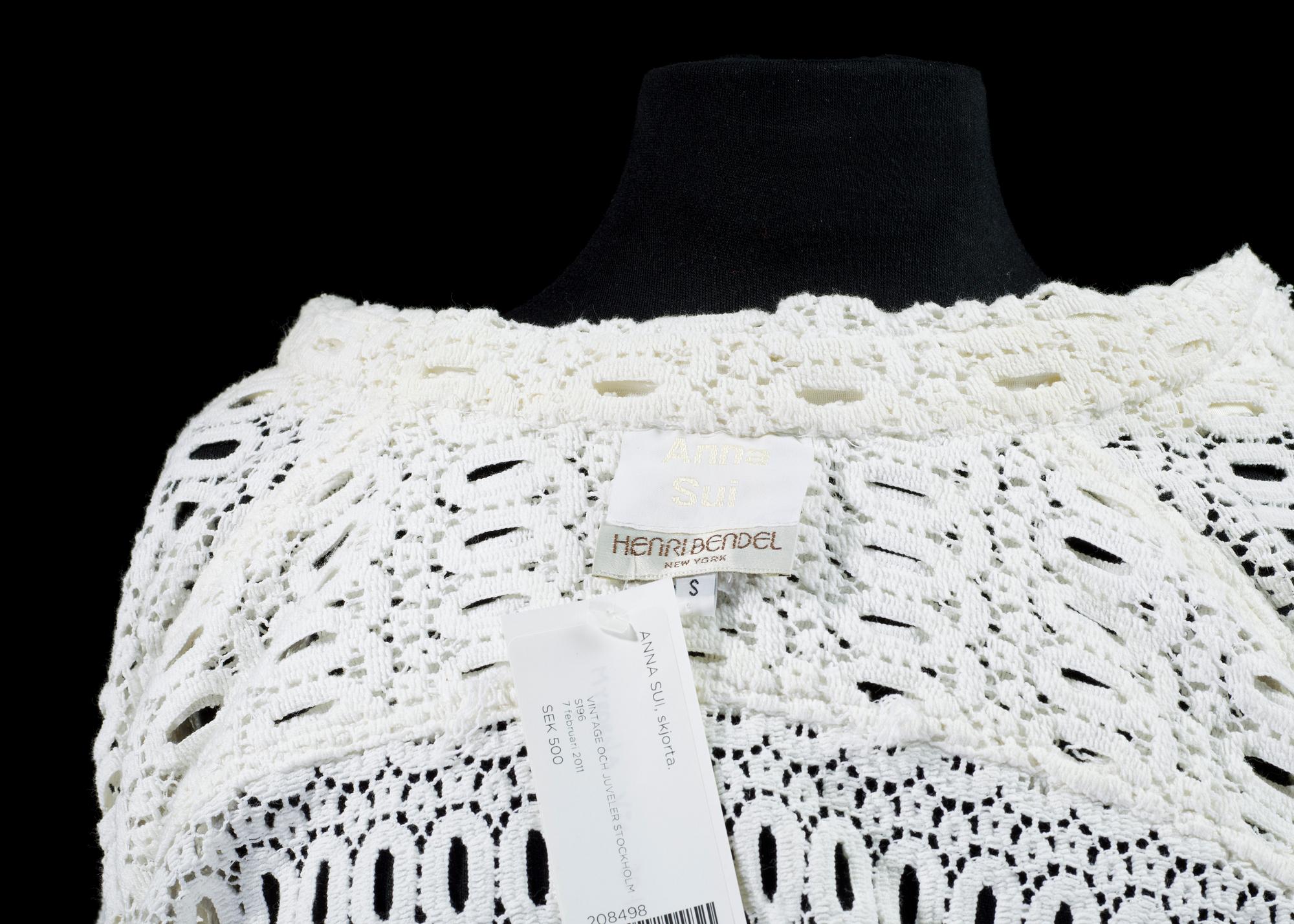 A white cottonlace shirt by Anna Sui.