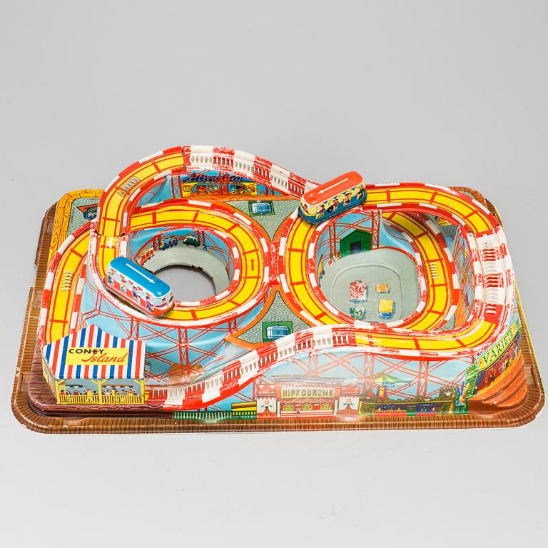A 1960's  German toy car track with two mechanic buses.